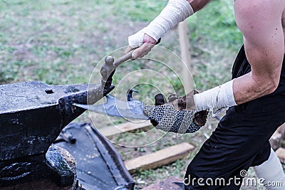 Forging Strength: The Blacksmith's Craft in the Middle Ages Stock Photo