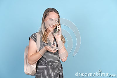 Middle caucasian in casual clothes with backpack and mobile phone talking Stock Photo