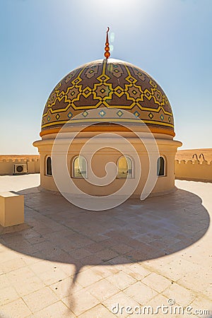 The dome of a mosque in the desert of Oman Stock Photo