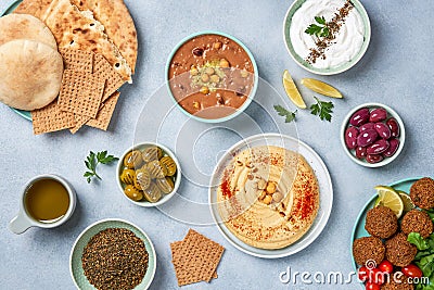 Middle eastern, arabic traditional breakfast with hummus, foul, falafel and zaatar. Top view Stock Photo