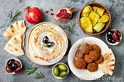 Middle Eastern traditional dinner. Authentic arab cuisine. Meze party food. Top view, flat lay, overhead. Stock Photo