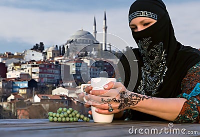 Middle Eastern Woman at Cafe Terrace Stock Photo