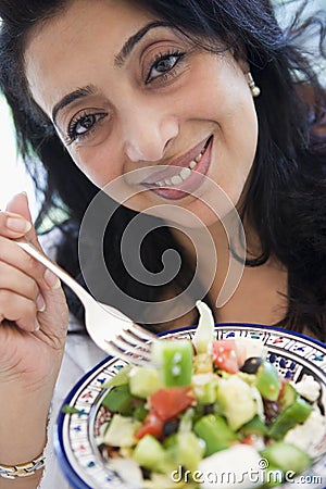 Middle Eastern woman holding a salad Stock Photo