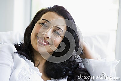 A Middle Eastern woman sitting at home Stock Photo