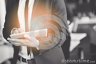 Midsection of businessman using digital tablet in office Stock Photo