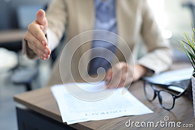 Midsection of a businesswoman with an open hand ready to seal a deal Stock Photo