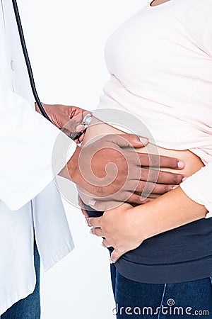 Midsection doctor checking pregnant woman Stock Photo