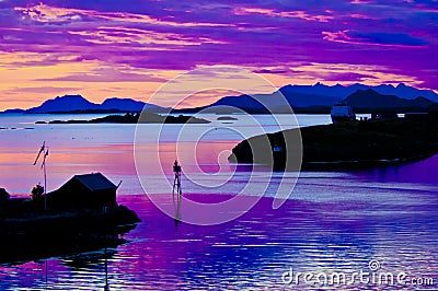 Midsummer night in Norway, colorful sky, reflecting in sea Stock Photo