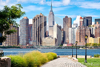 The midtown Manhattan skyline in New York City on a beautiful su Stock Photo