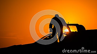 MiG-21 Lancer air fore pilot silhouette on sunset Top Gun fighter pilot Stock Photo