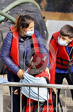 Migrant families with children arrive at the port of Dover after being rescued at sea. Editorial Stock Photo