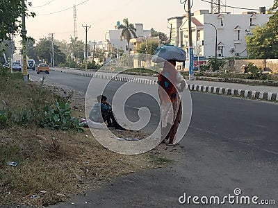 Migrant labours waiting for a ride Editorial Stock Photo