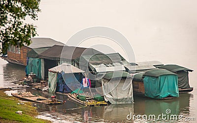 Migrant worker housing on rafts on Li River downtown, Guilin, China Editorial Stock Photo