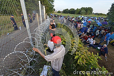 Migrants from Middle East waiting at hungarian border Editorial Stock Photo