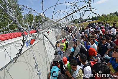 Migrants from Middle East waiting at hungarian border Editorial Stock Photo