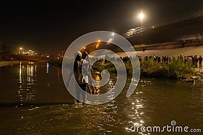 Migrants crossing border from Mexico to USA Editorial Stock Photo