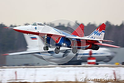 Mikoyan Gurevich MiG-29 of Swifts aerobatics team taking off at Kubinka air force base. Editorial Stock Photo