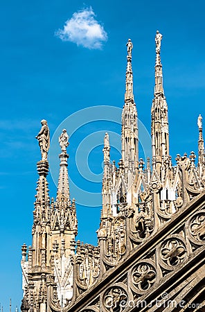 Milan Cathedral roof, Italy. Famous Milan Cathedral or Duomo di Milano is a top landmark of Milan. Luxury Gothic spires with Stock Photo