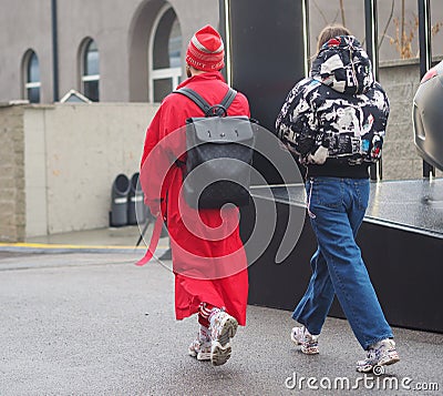 MILAN - FEBRUARY 22, 2018: Fashionable couple street style outfit Editorial Stock Photo