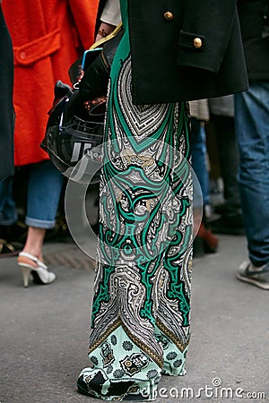 Woman poses for photographers with green intricate floral design before Etro and Iceberg fashion show, Milan Editorial Stock Photo