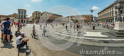 MILAN, ITALY - AUGUST 1, 2019 : Wide angle panorama. The Cathedral Square, looking from main stairs of facade of the Duomo and the Editorial Stock Photo
