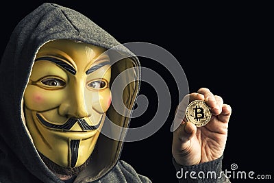 Hacker hold bitcoin Editorial Stock Photo