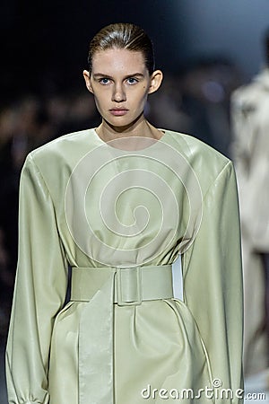 MILAN, ITALY - FEBRUARY 24: A model walks the runway at the Tods fashion show during the Milan Fashion Week Editorial Stock Photo