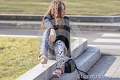 Model wears leopard pants and a black jacket Editorial Stock Photo