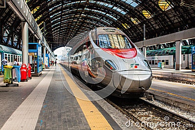 MILAN, ITALY - JULY 14, 2016. Milan Central Station high speed train Trenitalia Frecciarossa, red arrow. Editorial Stock Photo