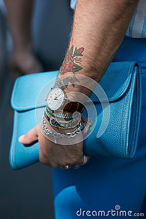 Man with IWC watch and blue leather bag before Fendi fashion show, Milan Fashion Week street style Editorial Stock Photo