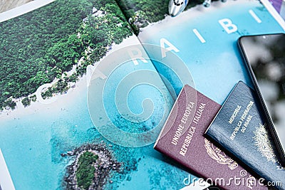 Milan, Italy - June 2023: Travel documents on a tourist magazine ready for the Caraibi tour. Holidays concept. Holiday Editorial Stock Photo