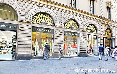 Tourists walking at the famous shops of Milan city Italy Editorial Stock Photo
