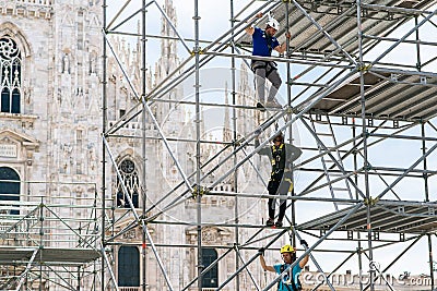 Milan. Workers Assemble a Steel Structure in Front of Milan Cathedral. Italy Editorial Stock Photo