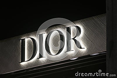 Dior logo displayed on a facade of a store in Milan Editorial Stock Photo