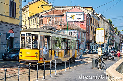 Milan, Italy, old yellow traditional tram on street in summer day Editorial Stock Photo