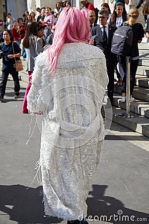 Woman with white and silver coat and pink hair before Genny fashion show, Milan Fashion Week Editorial Stock Photo