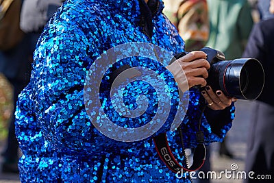 Woman with Canon professional camera and blue sequin coat before MSGM fashion show, Milan Fashion Week street Editorial Stock Photo