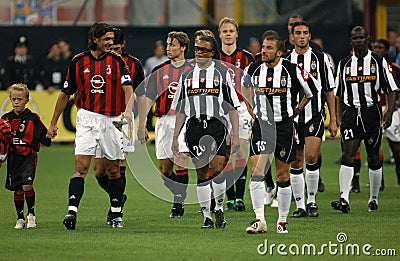 The Milan and Juventus players enter the field before the match Editorial Stock Photo