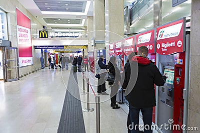 Tourists buying tickets from a ticket machine Stock Photo