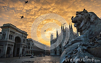 Milano piazza duomo cathedral galleria and lionmonument at sunrise cloudy sky Stock Photo