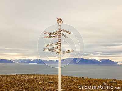 Mileage signpost at Pond Inlet, Baffin Island, Canada Stock Photo