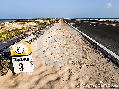 A milestone on the road to the island of Dhanushkodi Stock Photo