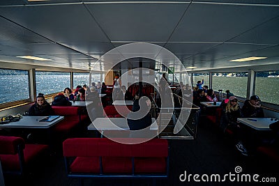 Milford Sound, New Zealand, October 5, 2019: Photograph of the interior of the boat that visits Milford Sound with people enjoying Editorial Stock Photo