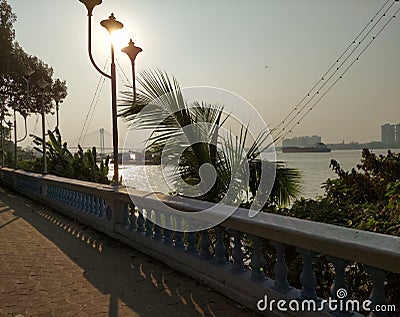 Milinium park at the bank of the river Ganges in Calcutta with a background of second Hooghly bridge. Stock Photo