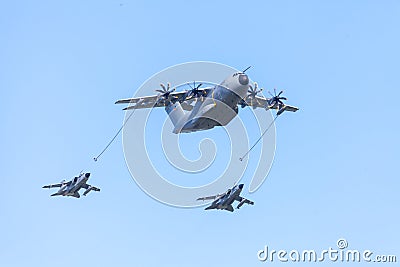 Military Airbus A 400 M transport plane flies with two Panavia Tornado multirole combat aircrafts Editorial Stock Photo