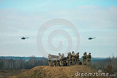 military army helicopters flying above military field Editorial Stock Photo