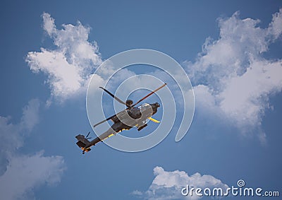 Military attack helicopter in flight Stock Photo