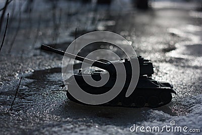 a military attack a toy tank at night Stock Photo