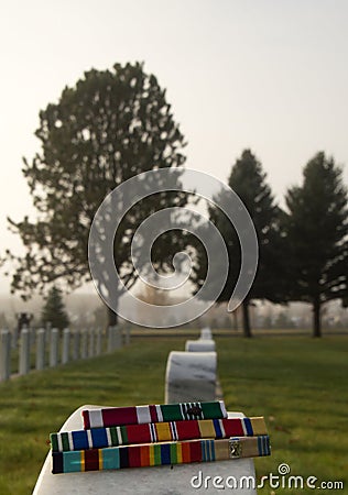 Military Award Ribbons on Veteran's Tombstone Stock Photo