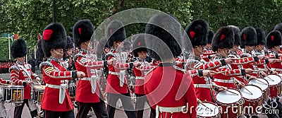 Military band belonging to the Irish Guards marches down The Mall during the Trooping the Colour military parade, London UK Editorial Stock Photo